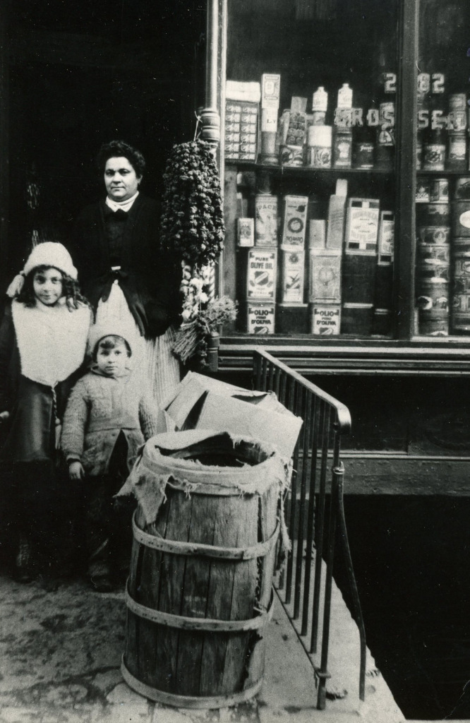 My grandmother with my aunt and uncle at her grocery store on Mott Street